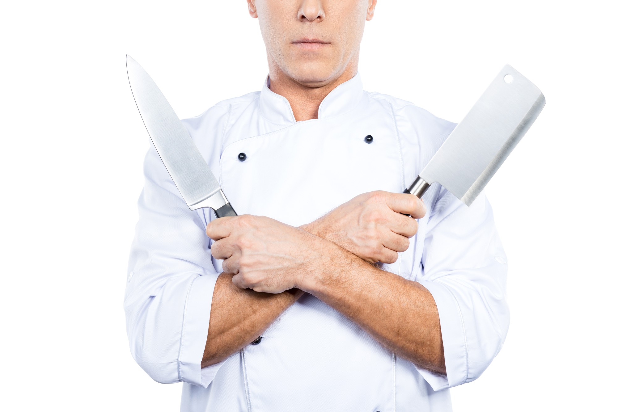 Chef che dimostra una tecnica di taglio